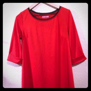 Red maternity dress with black trim